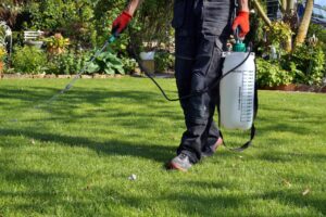 worker spraying lawn applications in El Dorado, Kansas