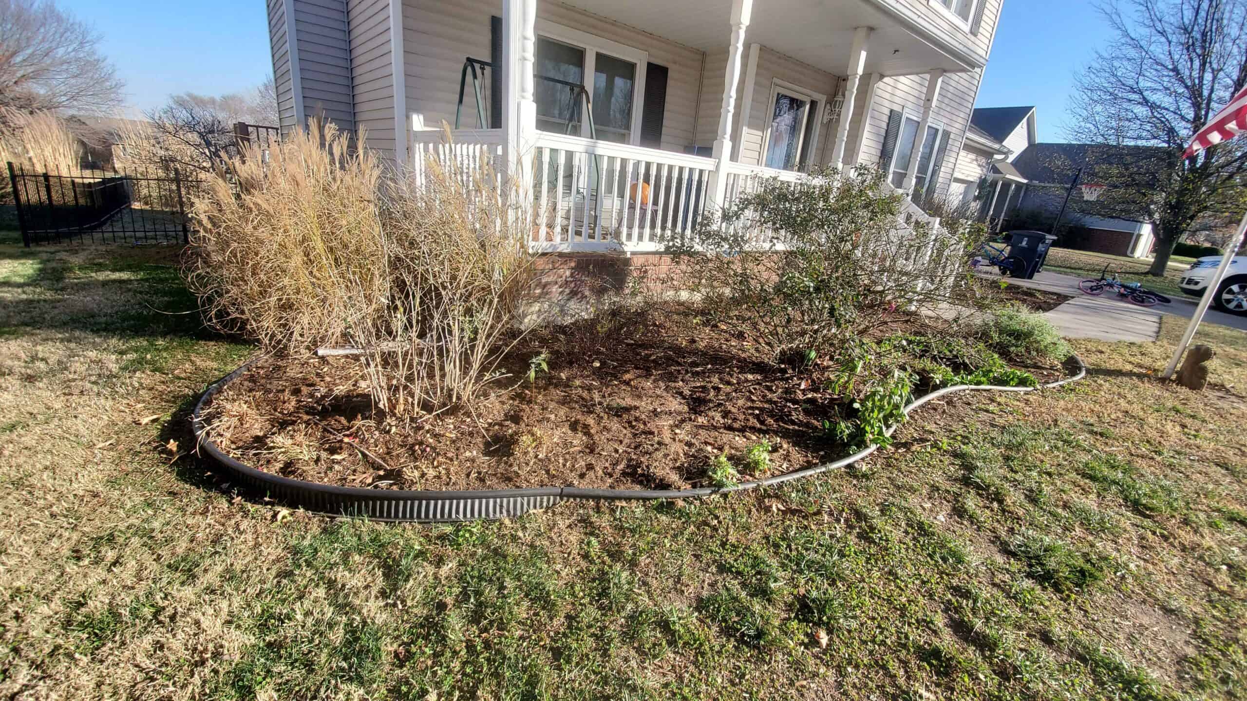 Apply mulch to flower beds and around hardscaping to maximize lawn health