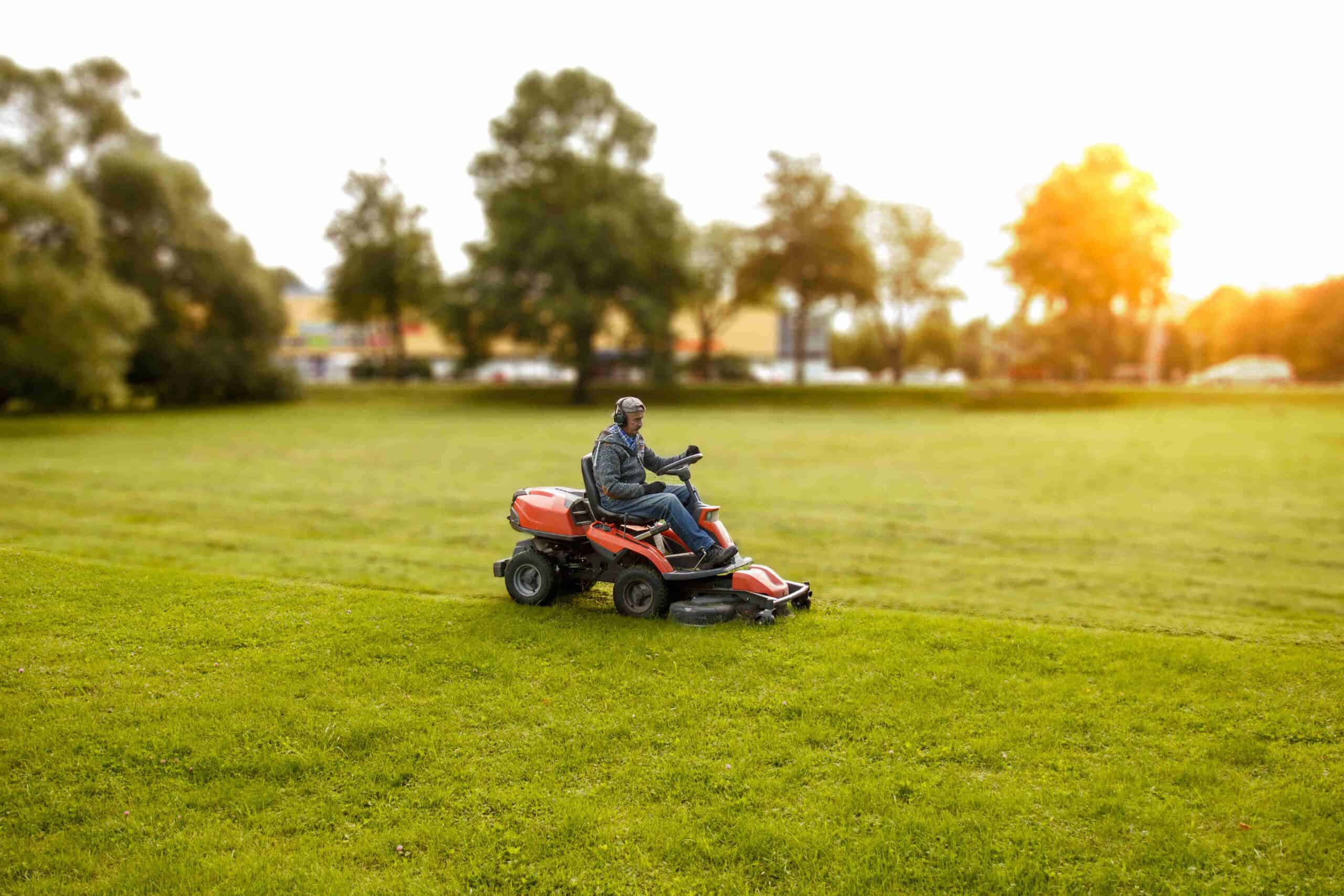 Person mowing the lawn on a ride-on mower
