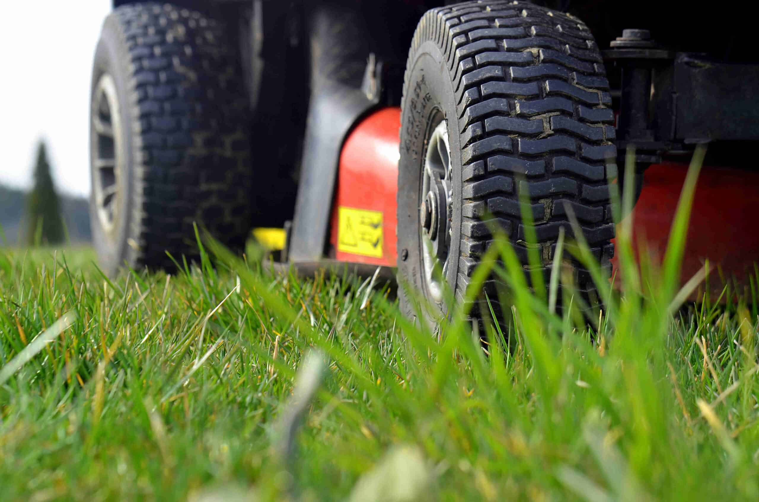 Close up of ride-on lawnmower mowing