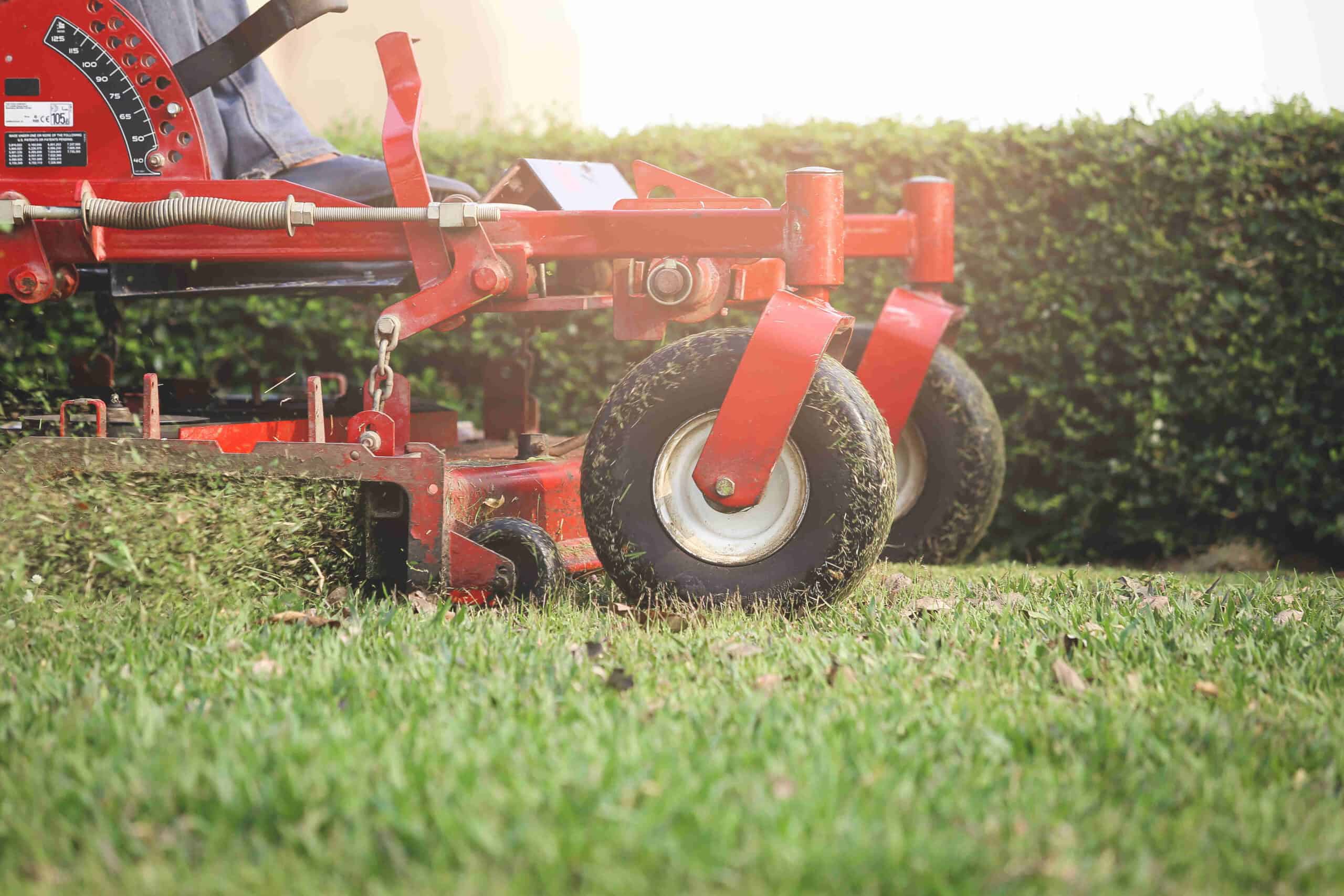 Close up of ride on mower mowing grass