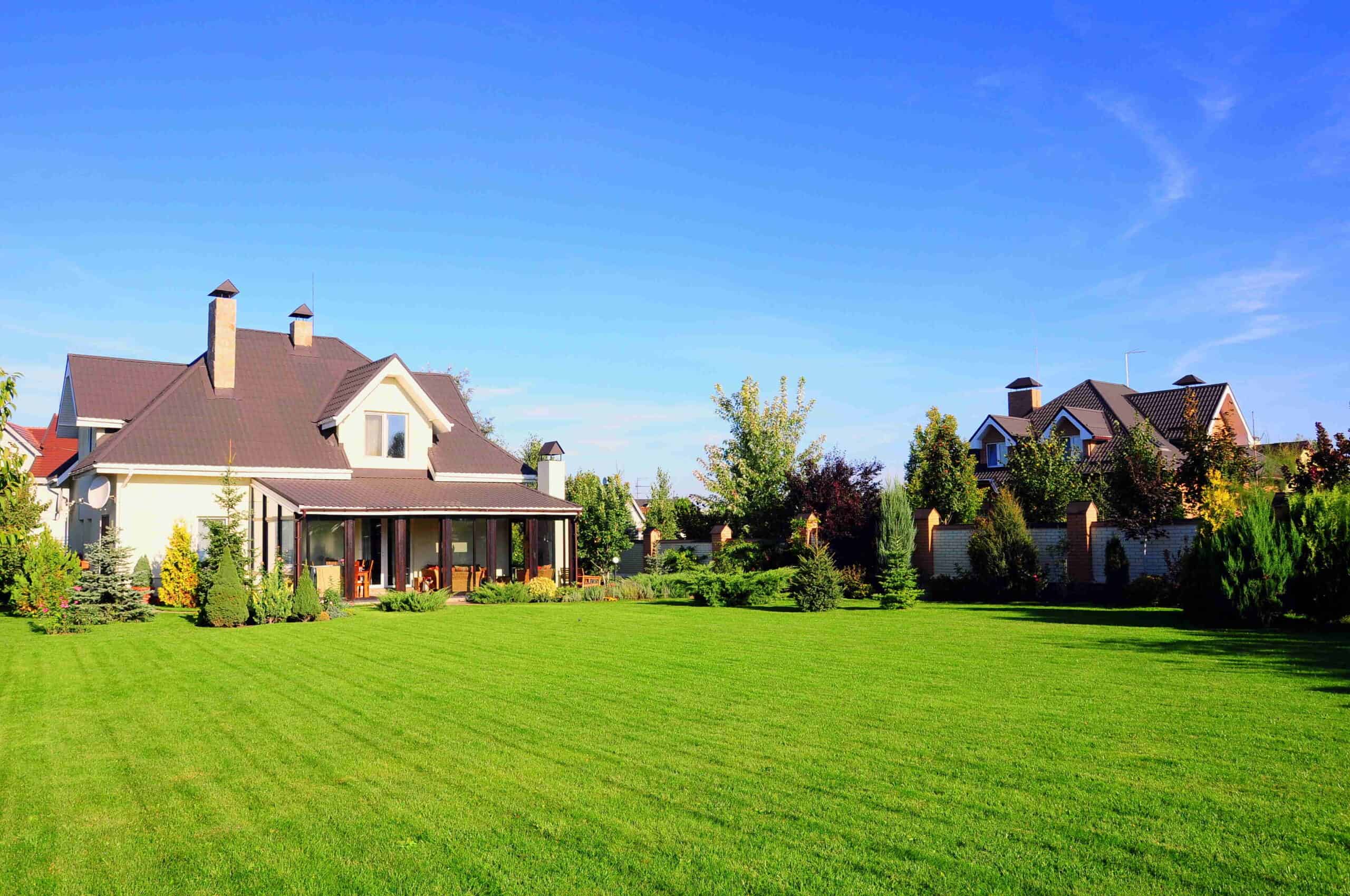 Wide shot of house with lawn after mowing