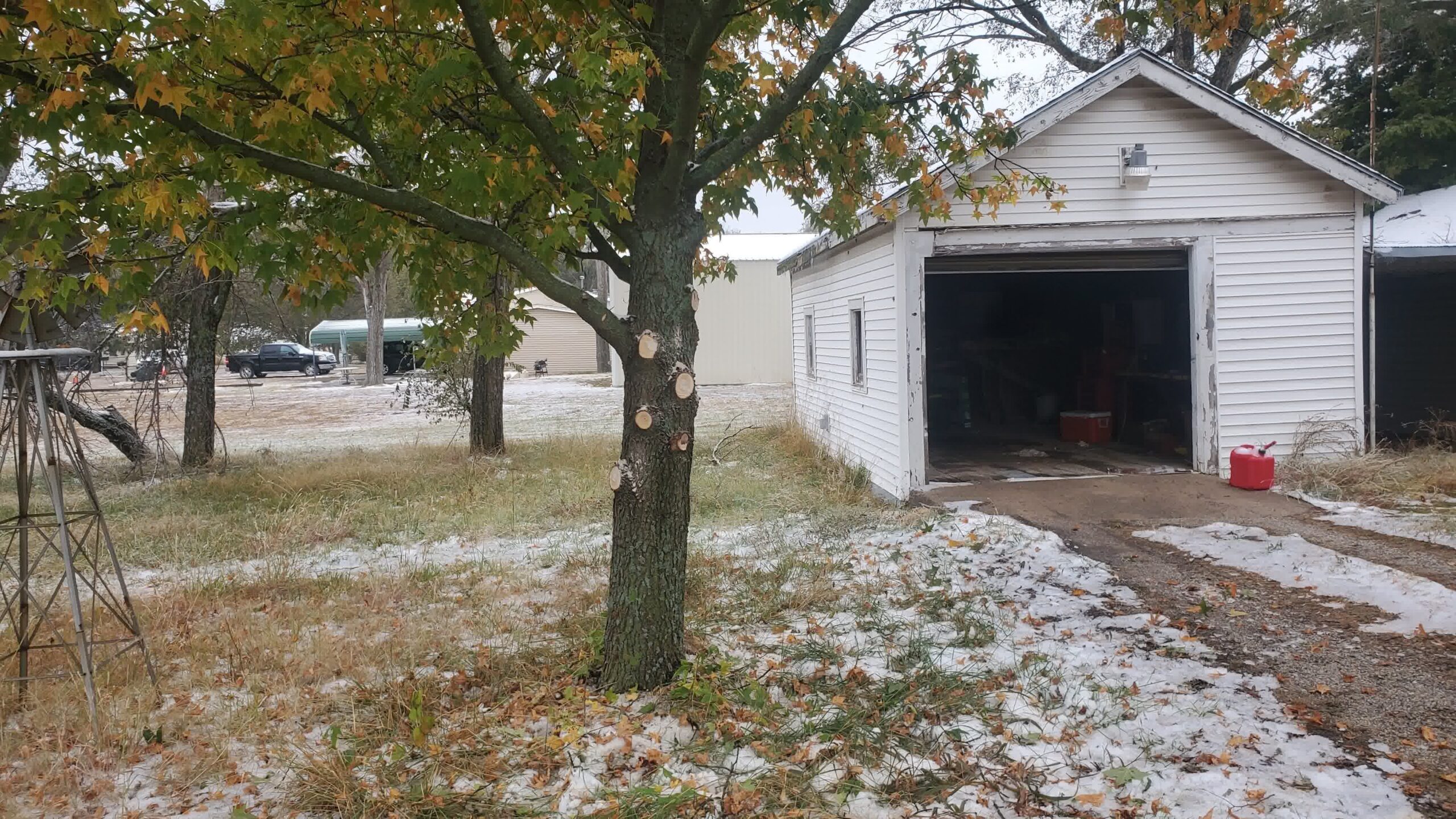 Melted snow in front of a garage.
