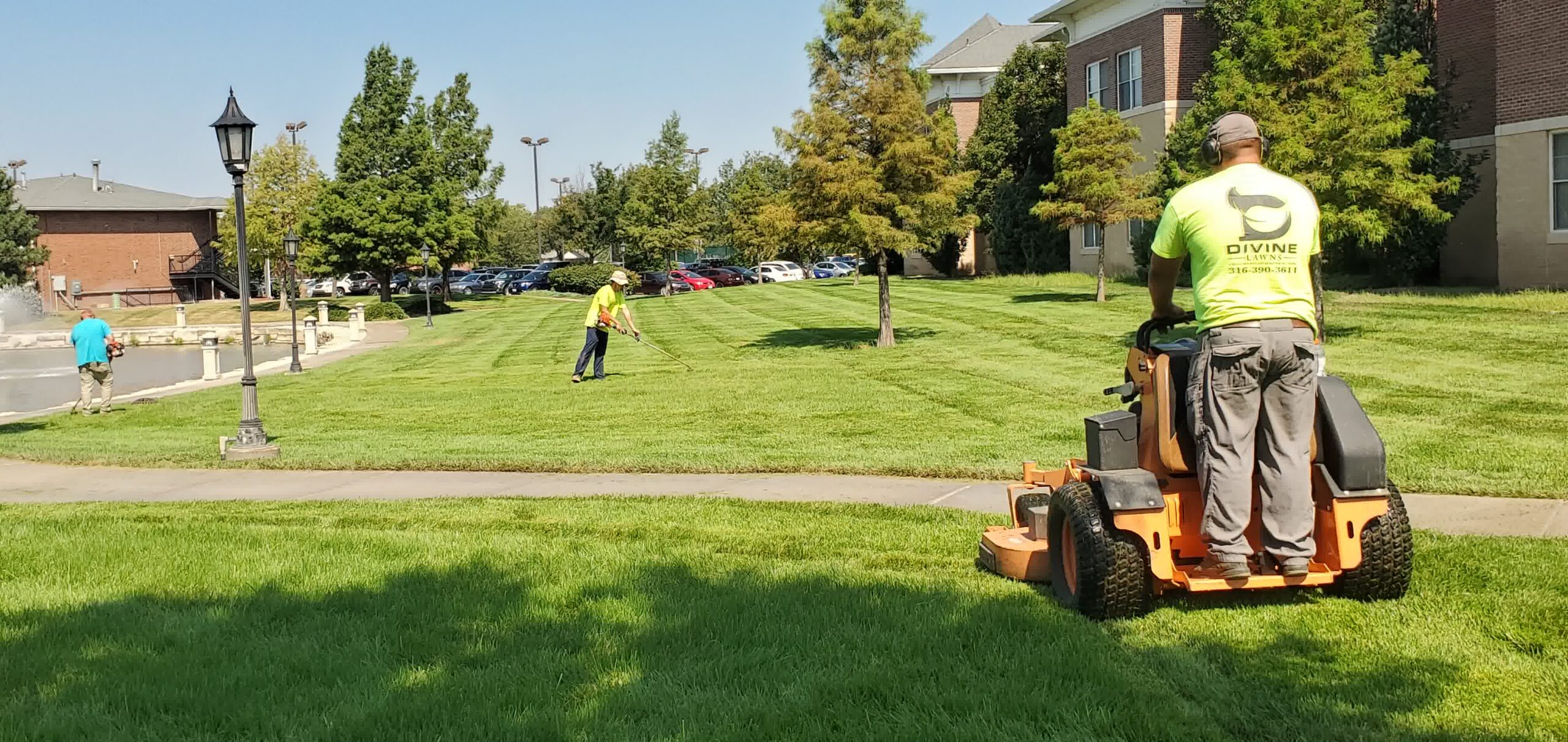 Our professional crew taking care of a lawn maintenance job for a satisfied client.